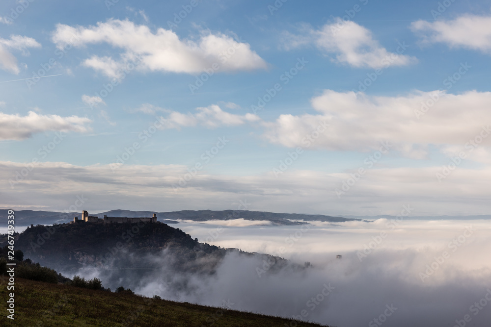 A view of Rocca Maggiore castle in Assisi (Umbria, Italy) in the middle of fog