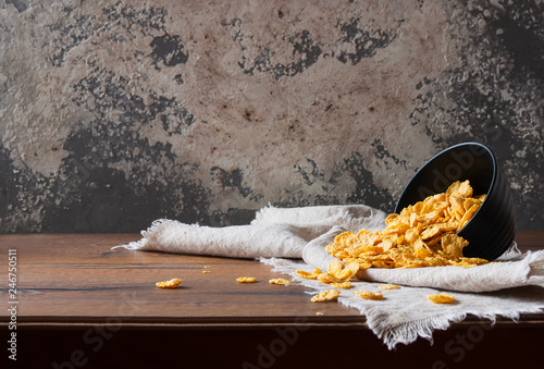 Сornflakes on wooden table at morning. The concept of diet, proper nutrition and a healthy lifestyle. Selective focus.