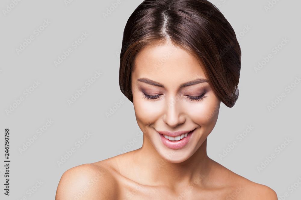 Studio portrait of a beautiful young woman with brown hair. Pretty model girl with perfect fresh clean skin. Beauty and skin care concept Studio portrait of a beautiful young woman with brown hair. Pretty model girl with perfect fresh clean skin. Beauty and skin care concept