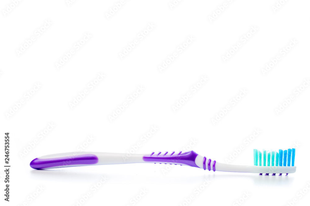 colored toothbrush on an isolated background, close up colored toothbrush on an isolated background, close up