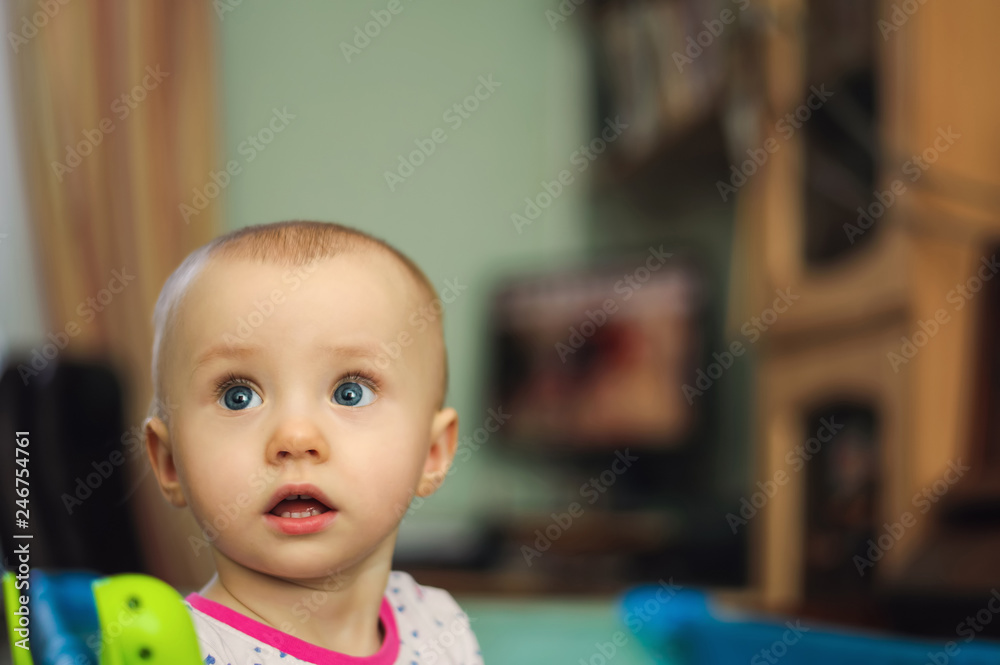 amazement pretty child standing in playpen