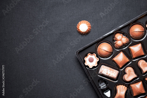 Closeup view of box of chocolates with variety chocolates pralines