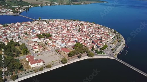 Aerial drone view video of famous island - fishing village of Aitoliko in Aetolia - Akarnania, Greece situated in the middle of Messolongi archipelago known as the Little Venice of Greece photo