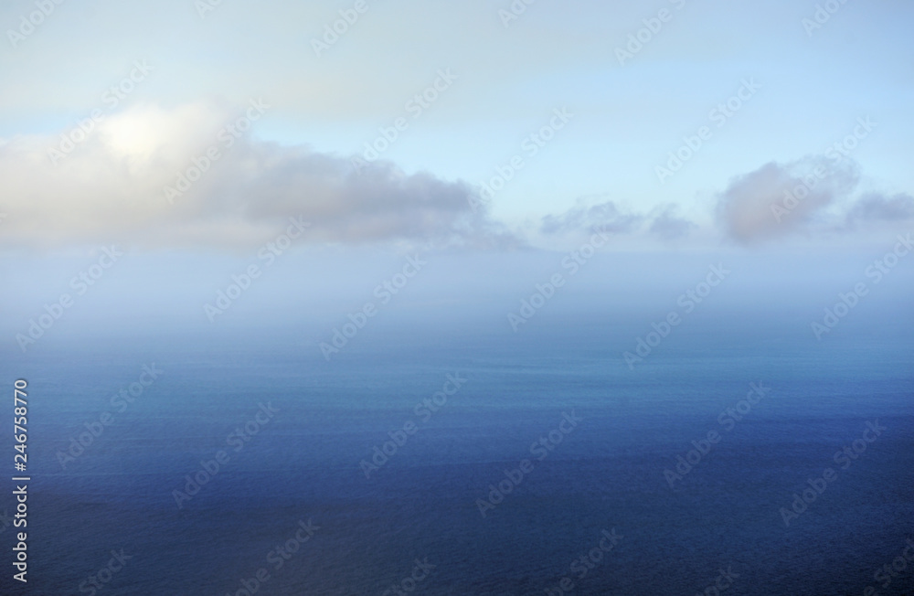 morning view of the ocean at the level of clouds
