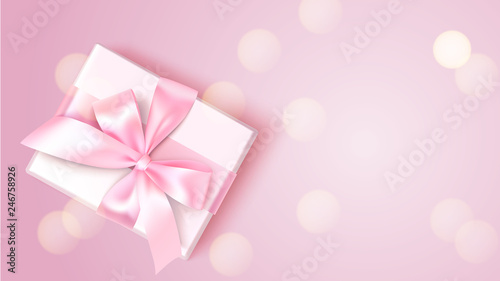 Holiday design template. Pink background with decorative white gift and blur lights. Vector illustration.