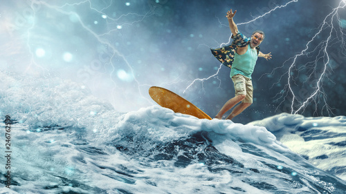 Canvas Print A senior man on a surfboard at sea