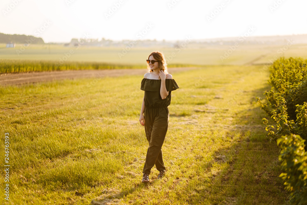 A girl in a hat on a walk in the park A girl in a hat on a walk in the park