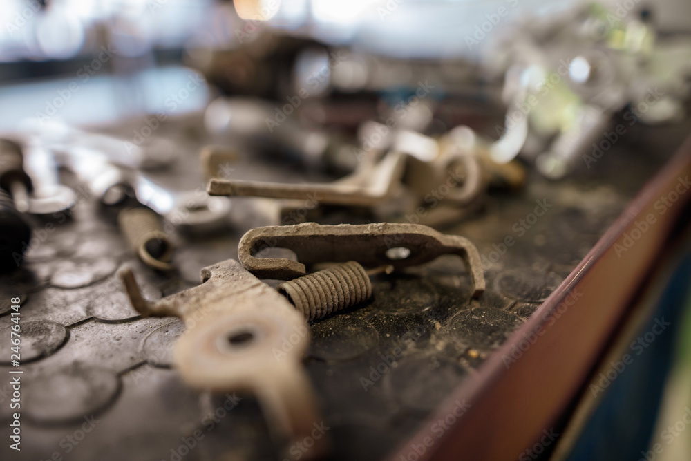 Bolts from the car in the workshop Bolts from the car in the workshop