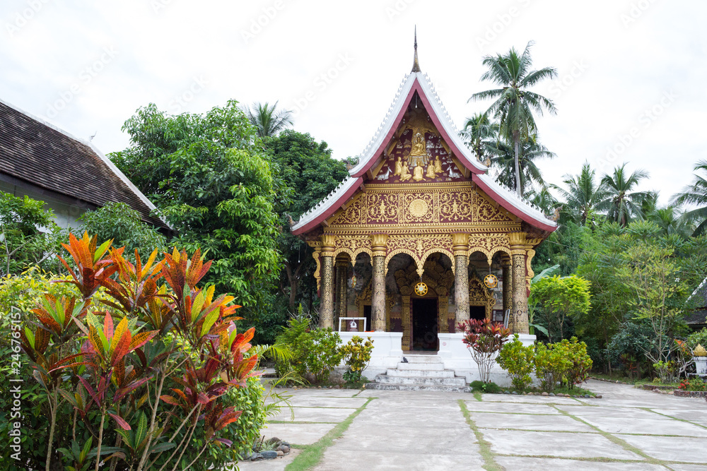 Luang Prabang, Laos – December 14, 2018: Beautiful buddhist temple in Luang Prabang old town, former capital of Laos and now a UNESCO World Heritage city.
