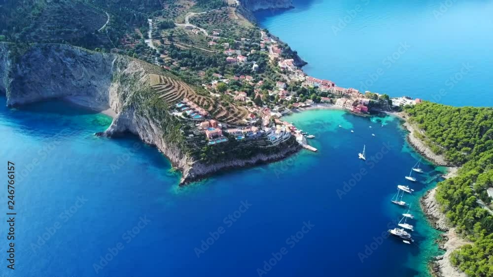 Aerial drone bird's eye view video of beautiful and picturesque colorful traditional fishing village of Assos in island of Cefalonia, Ionian, Greece Aerial drone bird's eye view video of beautiful and picturesque colorful traditional fishing village of Assos in island of Cefalonia, Ionian, Greece