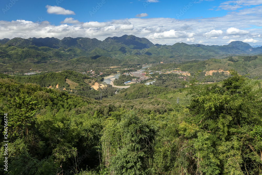 Green Valley covered with lush green forests and Mekong river near Luang Prabang in northern Laos Green Valley covered with lush green forests and Mekong river near Luang Prabang in northern Laos
