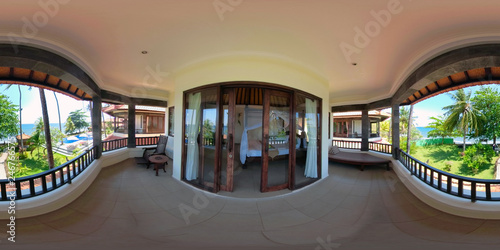 vr 360 view from the balcony of luxury hotel on sea. bedroom interior with large bed in luxury hotel. travel concept. photo