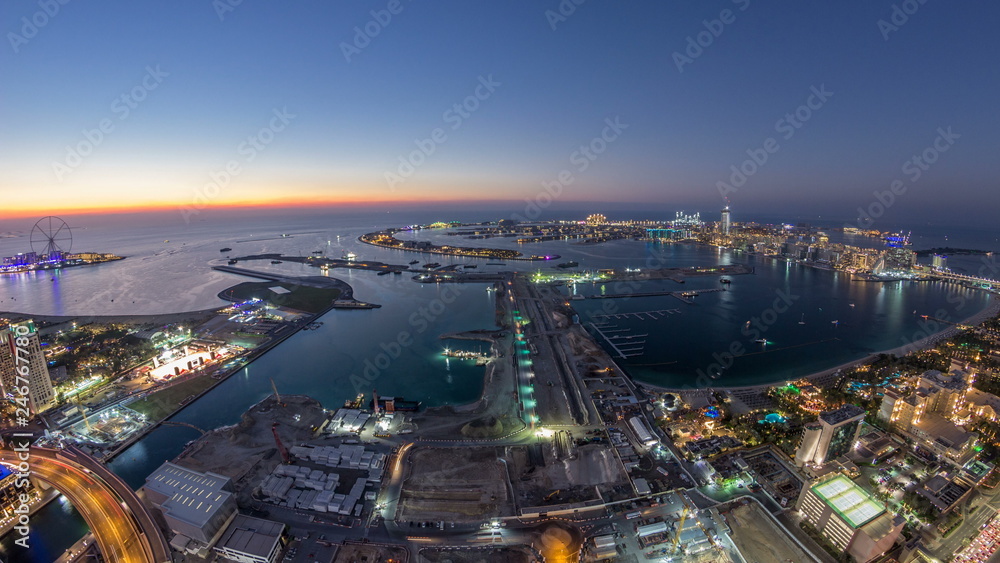 Fototapeta premium Aerial sunset view of Palm Jumeirah Island day to night timelapse.