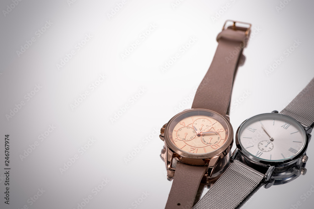 elegant swiss wristwatches lying on grey background elegant swiss wristwatches lying on grey background