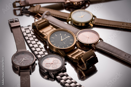 selective focus of luxury wristwatches on grey background photo