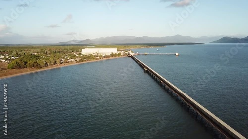 Aerial footage high up looking towards Lucinda panning along Lucinda sugarcane jetty in Tropical North Queensland Australia. photo