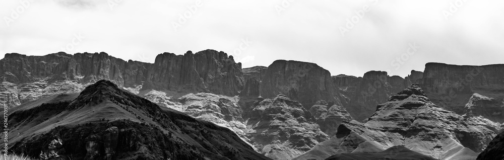 a black and white panorama of the drakensberg mountain range