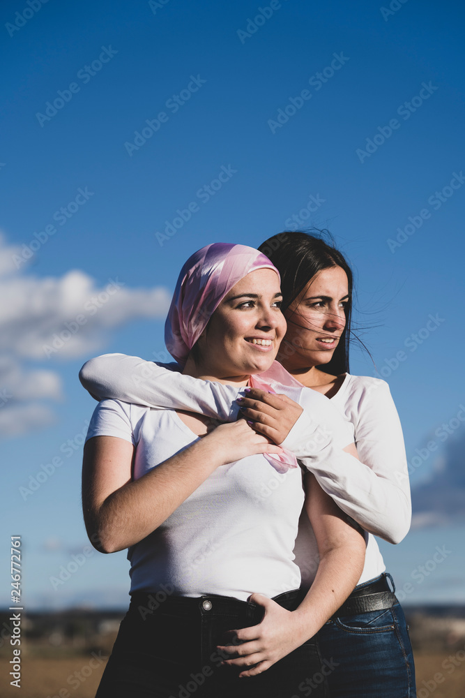 Two young beautiful woman with cancer bandana Two young beautiful woman with cancer bandana