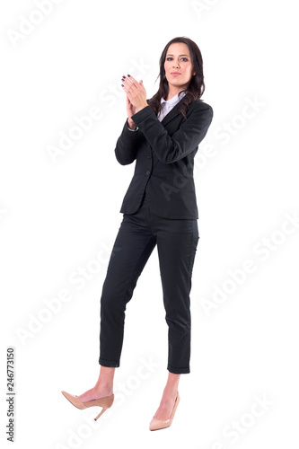 Pretty elegant business woman in suit applauding and admiring looking at camera. Full body isolated on white background. 