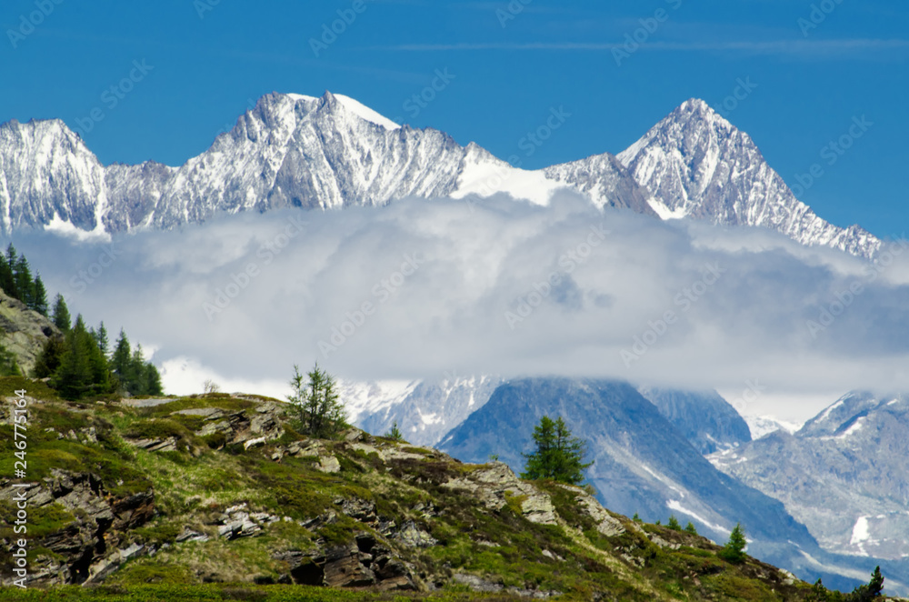 Snow-capped Mountain and Clouds with Clear Sky in Switzerland.