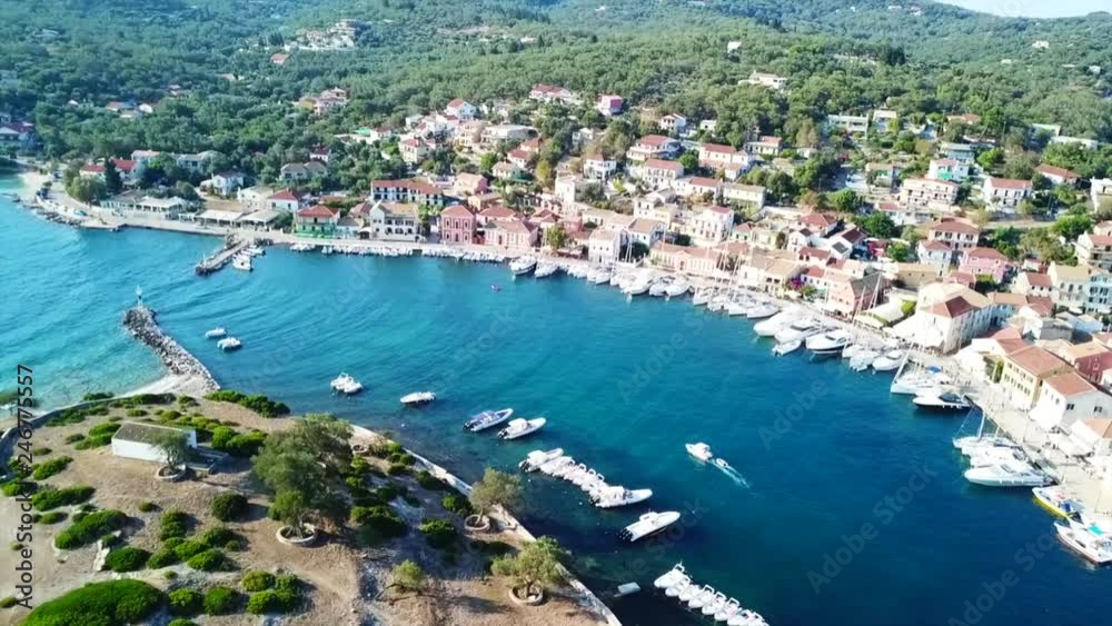 Aerial drone bird's eye view video of iconic small safe port of Gaios with traditional Ionian architecture and sail boats docked, Paxos island, Ionian, Greece Aerial drone bird's eye view video of iconic small safe port of Gaios with traditional Ionian architecture and sail boats docked, Paxos island, Ionian, Greece