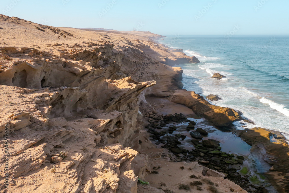 Atlantic coast waves are crashing into rocky cliffs near Agadir, Morocco