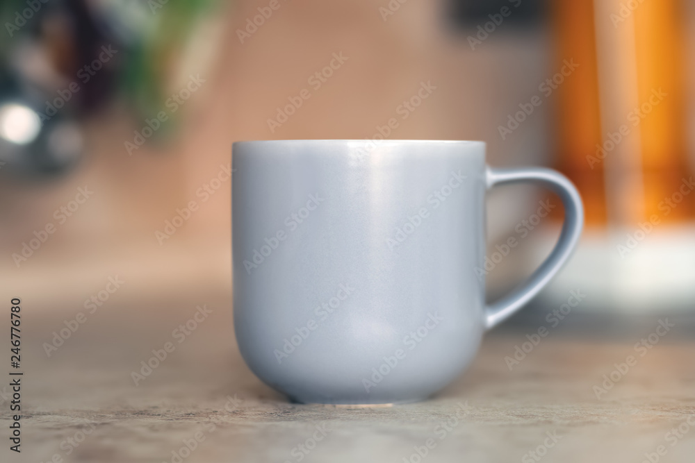 Fototapeta premium Gray mug on kitchen work surface