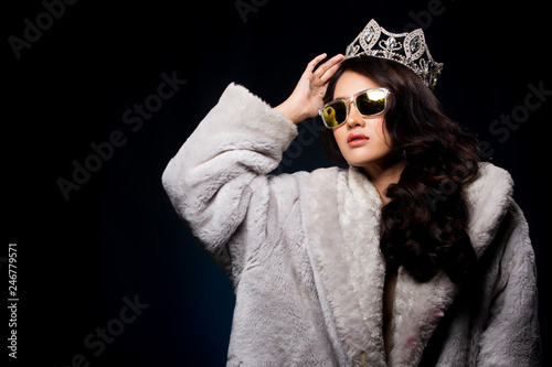 Portrait Miss Pageant beauty Contest in Asian Fur Gray winter jacket dress with Silver Diamond Crown Sash, fashion make up face hair style, studio lighting dark background bubble