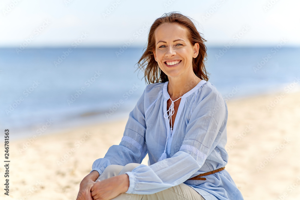 people and leisure concept - happy smiling woman on summer beach people and leisure concept - happy smiling woman on summer beach