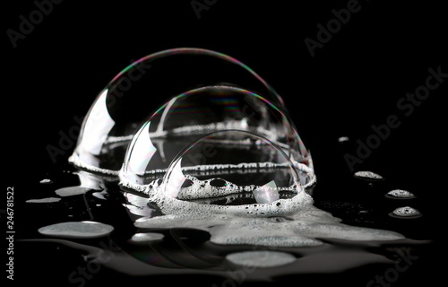 Foam bubbles isolated on black, with clipping path texture and background 