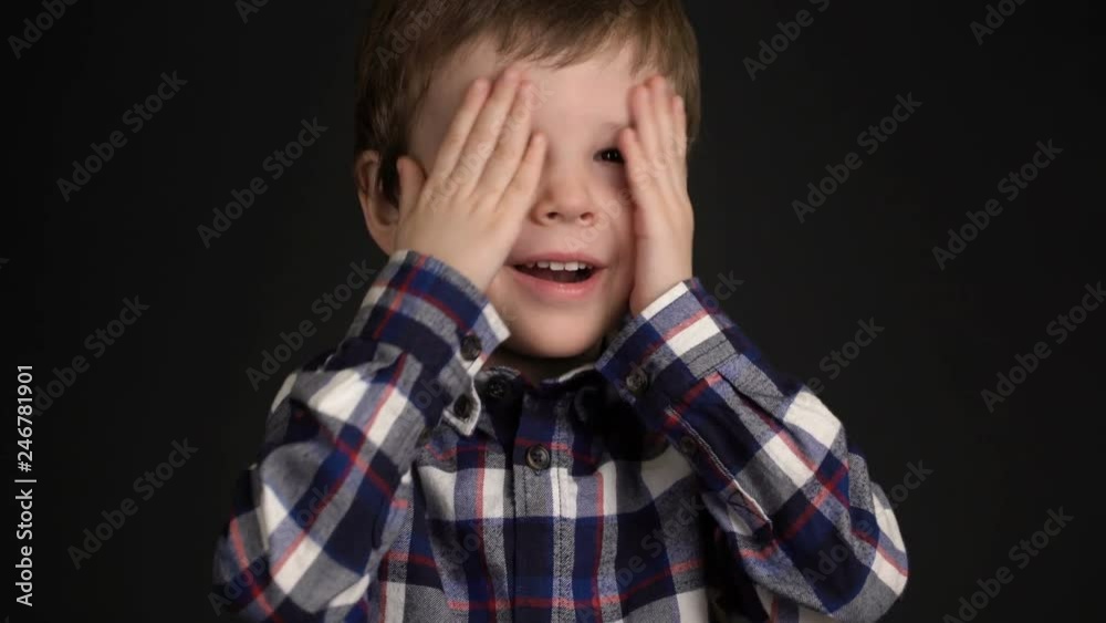portrait of little boy is laughing and looking at camera portrait of little boy is laughing and looking at camera