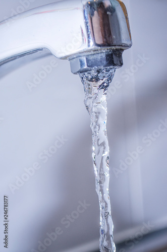 Close up of Tap with Water Running