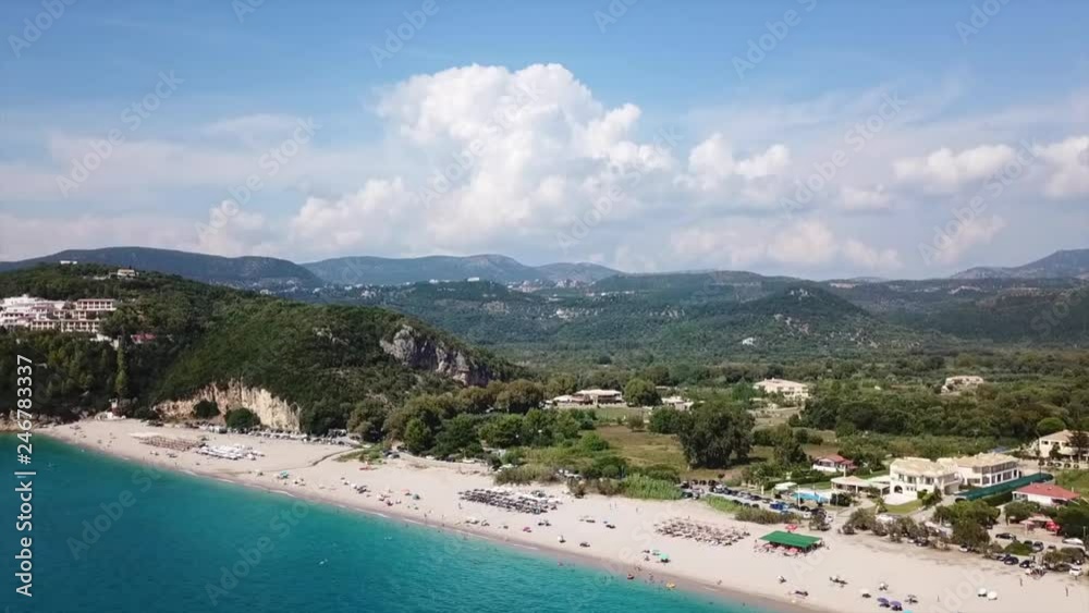 Aerial drone bird's eye view video of iconic paradise sandy beach of blue lagoon with deep turquoise clear sea and pine trees in complex island of Mourtos in Sivota area, Ionian, Epirus, Greece Aerial drone bird's eye view video of iconic paradise sandy beach of blue lagoon with deep turquoise clear sea and pine trees in complex island of Mourtos in Sivota area, Ionian, Epirus, Greece