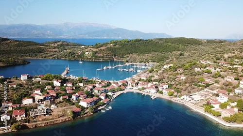 Aerial drone video of the one and only inhabited island in the Corinthian gulf called Trizonia with natural beauty and small safe port, Greece photo