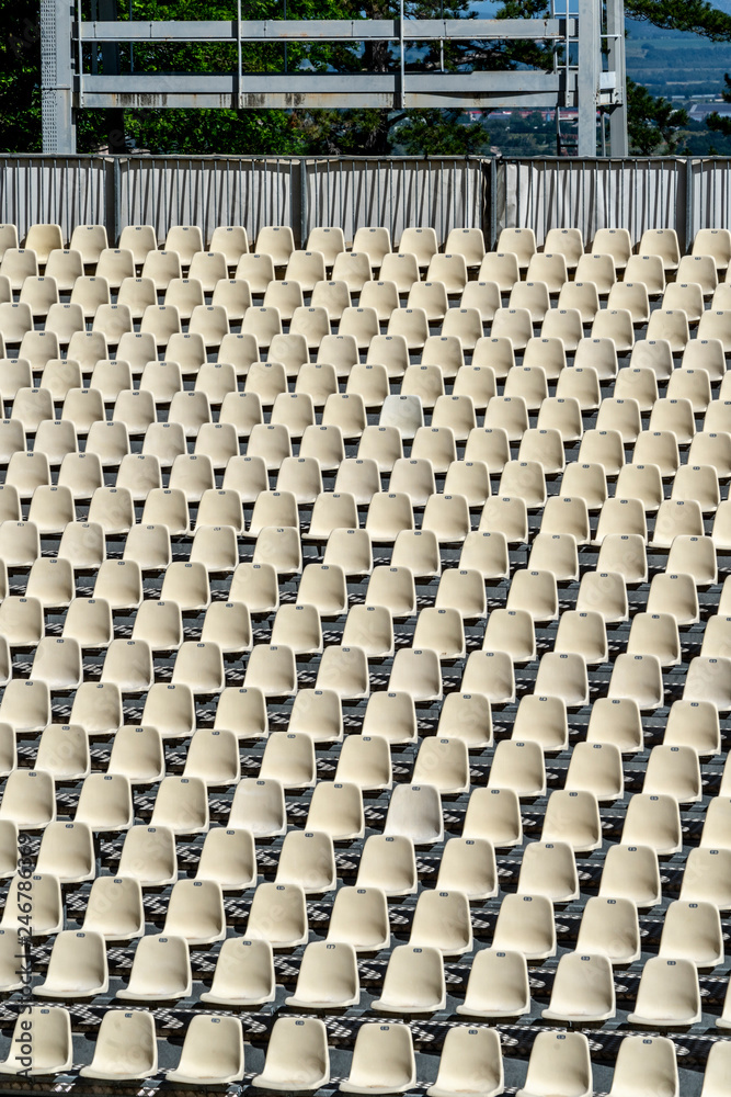 Fototapeta premium empty white seats with a boy sitting waiting