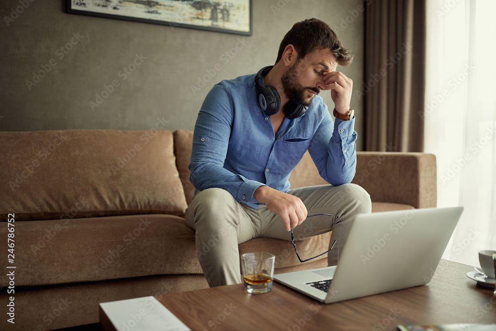 tired business man works at home at business project. tired business man works at home at business project.
