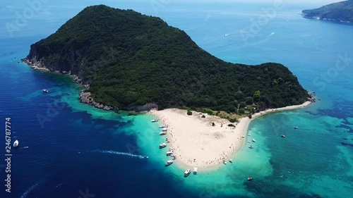 Aerial drone video of tropical island with volcanic caves and exotic emerald sea colour sandy beaches photo