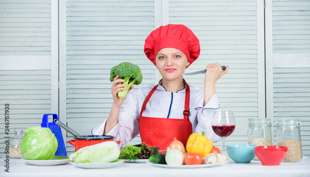 Turn broccoli into favorite ingredient. Broccoli nutrition value. Raw food diet. Woman professional chef hold raw broccoli vegetable. Free healthy vegetarian and vegan recipes. How to cook broccoli Turn broccoli into favorite ingredient. Broccoli nutrition value. Raw food diet. Woman professional chef hold raw broccoli vegetable. Free healthy vegetarian and vegan recipes. How to cook broccoli