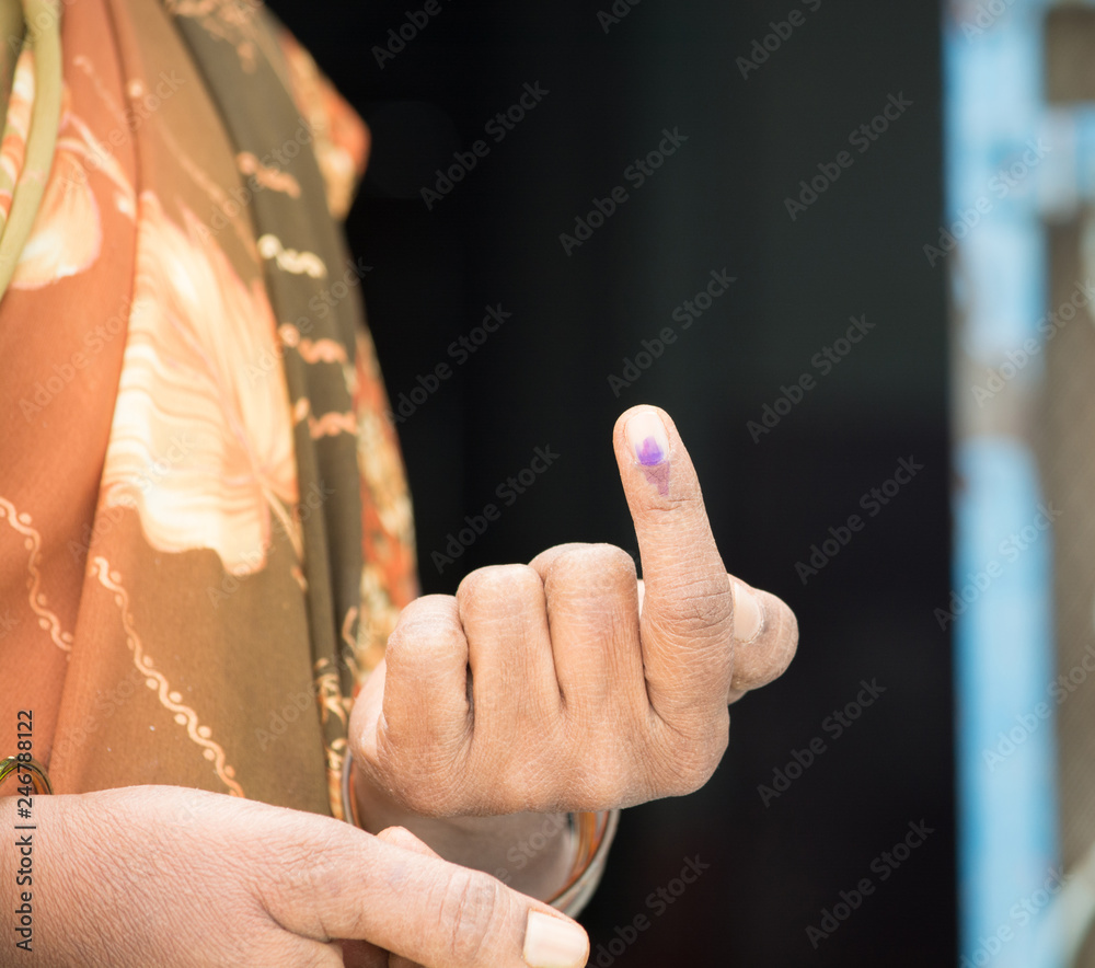 An Indian woman's hand showing voting mark after polling the Vote in election