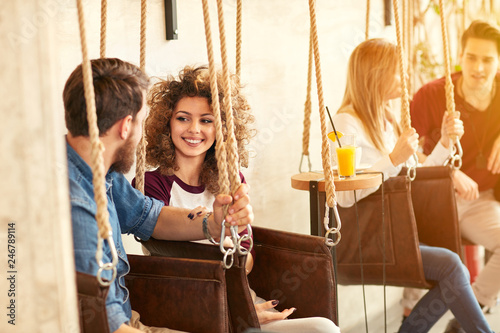 Young people enjoying on swing