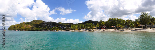 Superb panoramic view from the sea of the beautiful beach of Anse    l Ane near the village of Trois-Ilets in Martinique facing the city of Fort-de-France