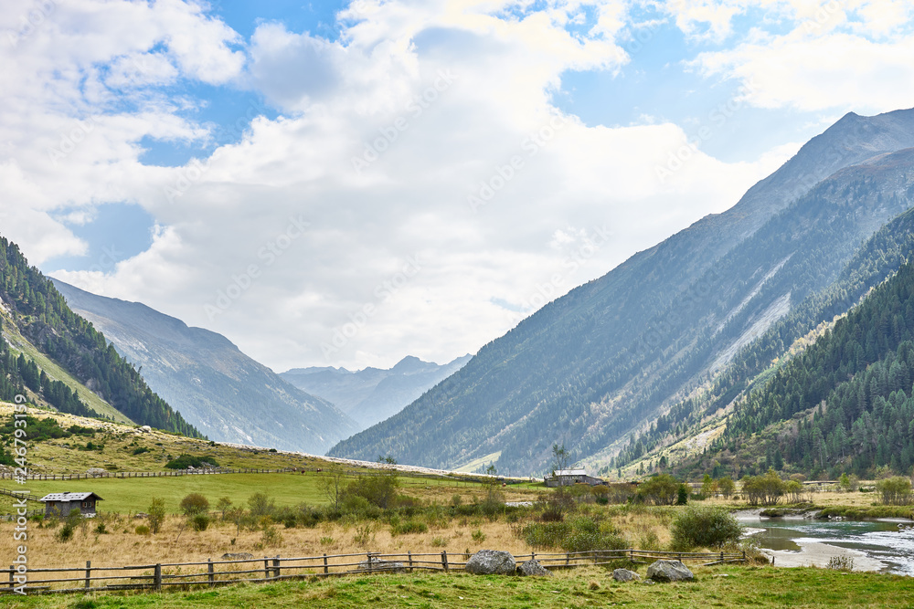 Hiking and biking on a trail in Krimml valley in Austria Hiking and biking on a trail in Krimml valley in Austria