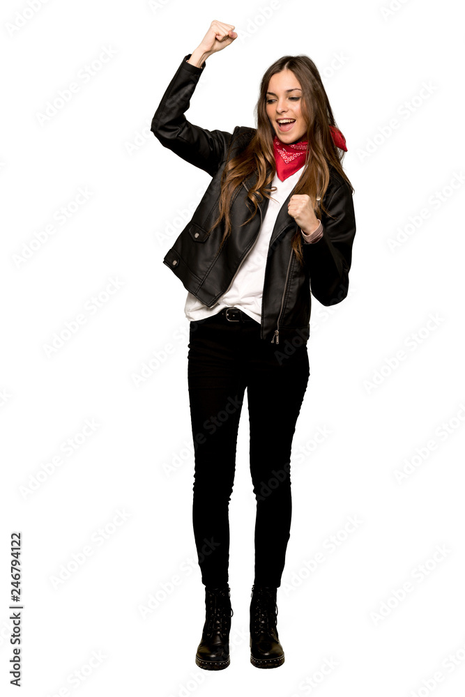 Full-length shot of Young woman with leather jacket celebrating a victory on isolated white background Full-length shot of Young woman with leather jacket celebrating a victory on isolated white background
