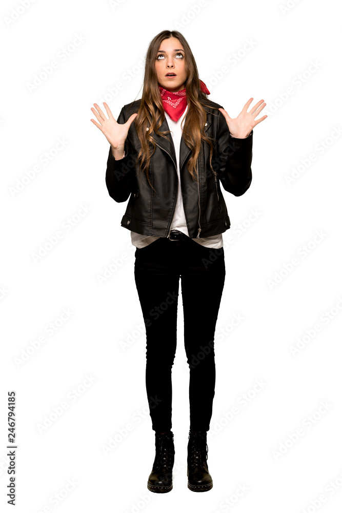 Full-length shot of Young woman with leather jacket frustrated by a bad situation on isolated white background Full-length shot of Young woman with leather jacket frustrated by a bad situation on isolated white background