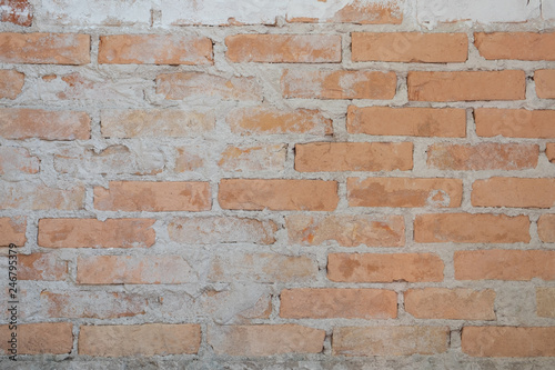 Old brick wall in antiquity and was damaged