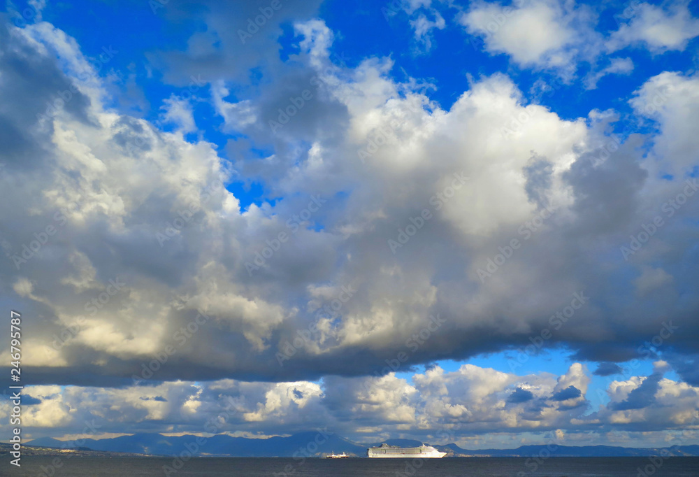 port of city of Naples with Vesuvius vulcan in background with cloudy blue sky, Napoli Italy port of city of Naples with Vesuvius vulcan in background with cloudy blue sky, Napoli Italy