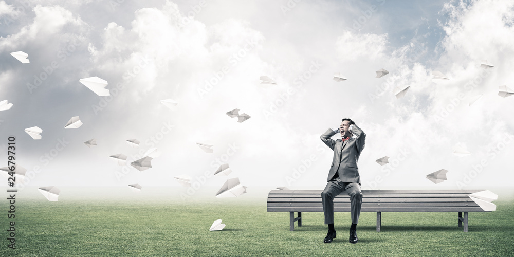 Young man in suit in park dont want to hear anything Young man in suit in park dont want to hear anything