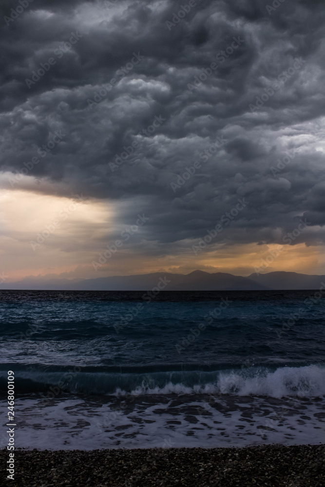 ocean with waves and dark clouds above before the storm beach