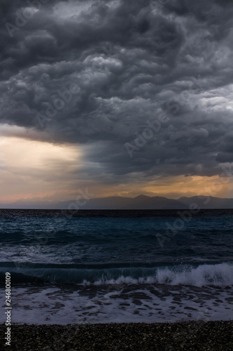 ocean with waves and dark clouds above before the storm beach