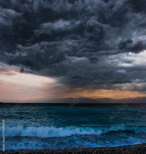 ocean with waves and dark clouds above before the storm beach